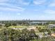 Wide aerial view of the city skyline, golf course, trees and homes in the distance at 454 35Th Ne Ave, St Petersburg, FL 33704