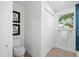 Well-lit bathroom featuring a toilet, closet, and shower with a window for natural light and ventilation at 454 35Th Ne Ave, St Petersburg, FL 33704