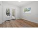A well-lit bedroom featuring French doors to the backyard and a window at 454 35Th Ne Ave, St Petersburg, FL 33704