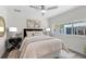 Cozy bedroom featuring natural light, ceiling fan, and modern decor at 454 35Th Ne Ave, St Petersburg, FL 33704