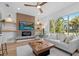 Inviting living room with built-in shelving, fireplace, large window, and stylish decor, creating a cozy atmosphere at 454 35Th Ne Ave, St Petersburg, FL 33704