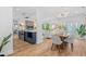 Bright, open living space with hardwood flooring, seamlessly blending kitchen and dining areas at 454 35Th Ne Ave, St Petersburg, FL 33704