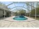 Sparkling screened-in pool and spa offer a relaxing outdoor oasis surrounded by lush landscaping at 454 35Th Ne Ave, St Petersburg, FL 33704