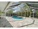 Large screened-in pool with an attached spa offering a private and tranquil outdoor retreat with lush greenery at 454 35Th Ne Ave, St Petersburg, FL 33704