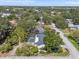 An aerial view of the screened-in pool and mature landscaping at 454 35Th Ne Ave, St Petersburg, FL 33704