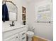 Clean bathroom with a white vanity, updated fixtures, and natural light from the window at 4616 S Matanzas Ave, Tampa, FL 33611