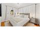 Serene bedroom with neutral tones, a plush bed, and soft lighting at 4616 S Matanzas Ave, Tampa, FL 33611