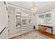 Organized walk-in closet with ample shelving, drawers, and a charming vanity area at 4616 S Matanzas Ave, Tampa, FL 33611
