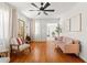 Inviting living room featuring hardwood floors, a ceiling fan, and neutral decor at 4616 S Matanzas Ave, Tampa, FL 33611