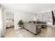 Comfortable living room showcasing a large sectional sofa and a view into the bedroom at 4616 S Matanzas Ave, Tampa, FL 33611