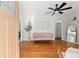 Bright living room with hardwood floors, pink sofa, and stylish decor at 4616 S Matanzas Ave, Tampa, FL 33611