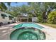 Relaxing backyard with large pool, connected spa, lounge chairs, and outdoor patio area is ideal for entertaining at 4616 S Matanzas Ave, Tampa, FL 33611