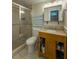 Well-maintained bathroom featuring a glass shower, vanity with storage and granite countertops at 4725 Soapstone Dr, Tampa, FL 33615