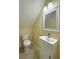 Compact bathroom features a modern sink and vanity, along with a low flow toilet at 4725 Soapstone Dr, Tampa, FL 33615