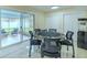 The dining room is surrounded by sliding glass doors that provides views to the outdoors at 4725 Soapstone Dr, Tampa, FL 33615