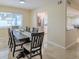 Bright dining room with large window provides ample light and views into the open kitchen at 4725 Soapstone Dr, Tampa, FL 33615