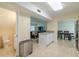 An open floor plan features an open kitchen that flows into the living room with views to a dining room at 4725 Soapstone Dr, Tampa, FL 33615