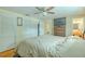 Inviting primary bedroom with hardwood floors, TV, and an ensuite bathroom at 4725 Soapstone Dr, Tampa, FL 33615