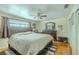 Spacious bedroom featuring a large bed, wood floors, and ample closet space at 4725 Soapstone Dr, Tampa, FL 33615