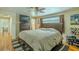 Comfortable bedroom showcasing hardwood floors, ceiling fan, and neutral paint at 4725 Soapstone Dr, Tampa, FL 33615