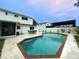 Inviting backyard pool area with patio seating, creating a relaxing and enjoyable outdoor space at 4725 Soapstone Dr, Tampa, FL 33615