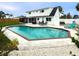 Beautiful backyard with a swimming pool and an outdoor seating area, perfect for entertaining guests at 4725 Soapstone Dr, Tampa, FL 33615