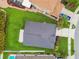 Straight down aerial view of a home with a grey shingled roof and a large green lawn at 630 Lake Cypress Cir, Oldsmar, FL 34677