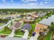 An aerial view of a peaceful neighborhood featuring waterfront homes and well-manicured landscaping at 630 Lake Cypress Cir, Oldsmar, FL 34677