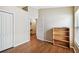 Bedroom with hardwood floors, a closet, and a bookshelf by the window at 630 Lake Cypress Cir, Oldsmar, FL 34677