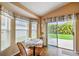 Cozy breakfast nook with large windows and sliding glass doors to the patio at 630 Lake Cypress Cir, Oldsmar, FL 34677