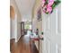 Inviting foyer with hardwood floors, neutral paint, and view into the spacious living area at 630 Lake Cypress Cir, Oldsmar, FL 34677