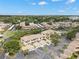 An aerial view of the condo community, showing the layout of the buildings, parking areas, and surrounding green spaces at 6330 99Th N Way # 14B, Seminole, FL 33708