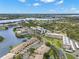 An aerial view of the condo community, highlighting its location with waterfront views, surrounding greenery, and community features at 6330 99Th N Way # 14B, Seminole, FL 33708