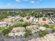 An aerial view of the condo community with red arrow, highlighting its location among lush landscaping and well-maintained grounds at 6330 99Th N Way # 14B, Seminole, FL 33708