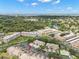 An aerial view of the condo community with red arrow, showcasing its proximity to a beautiful lake and natural surroundings at 6330 99Th N Way # 14B, Seminole, FL 33708