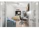 Bright bedroom with full sized bed, desk, and ceiling fan at 6330 99Th N Way # 14B, Seminole, FL 33708