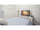 Nicely decorated bedroom with large dresser, TV and comfortable king sized bed at 6330 99Th N Way # 14B, Seminole, FL 33708