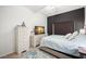 Calm bedroom featuring a large bed, dresser and flat screen television at 6330 99Th N Way # 14B, Seminole, FL 33708