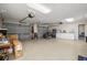 Spacious three car garage with epoxy flooring and custom storage solutions at 6330 99Th N Way # 14B, Seminole, FL 33708