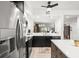 The bright kitchen is equipped with stainless steel appliances and sleek black and white cabinetry at 6330 99Th N Way # 14B, Seminole, FL 33708