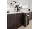 Close up of a kitchen with modern cabinetry, stainless steel wine cooler, and a bright countertop at 6330 99Th N Way # 14B, Seminole, FL 33708