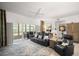 Spacious living room offering ample seating, a ceiling fan, and access to the screened porch through sliding glass doors at 6330 99Th N Way # 14B, Seminole, FL 33708