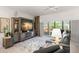 Comfortable living room featuring an entertainment center, sliding glass doors, and a cozy seating area at 6330 99Th N Way # 14B, Seminole, FL 33708