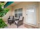 Comfortable front patio area with seating and well manicured landscaping at 6330 99Th N Way # 14B, Seminole, FL 33708