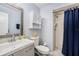 Bathroom with a shower, vanity, and matching cabinet, all in neutral colors at 6346 Bonnie Bay N Cir, Pinellas Park, FL 33781