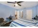 Spacious bedroom with blue walls and two large closets at 6346 Bonnie Bay N Cir, Pinellas Park, FL 33781
