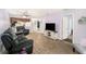 Inviting living room boasts durable laminate flooring and comfortable seating at 6346 Bonnie Bay N Cir, Pinellas Park, FL 33781