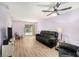 Serene living room with soft lighting, laminate floors and access to screened in lanai at 6346 Bonnie Bay N Cir, Pinellas Park, FL 33781