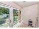 Enclosed sun room area with large windows, tile floors, and backyard access at 6346 Bonnie Bay N Cir, Pinellas Park, FL 33781