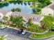 Aerial view of community showcasing pond, mature landscaping and convenient parking at 6706 47Th N St, Pinellas Park, FL 33781